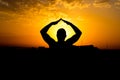 Silhouette of man with their hands in the sunset. Outdoor shot Royalty Free Stock Photo