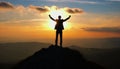 silhouette of a man on top who has reached the top of the mountain