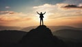 silhouette of a man on top who has reached the top of the mountain