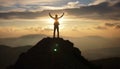 silhouette of a man on top who has reached the top of the mountain