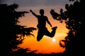 Silhouette man while trains parkour on sunset outdoor