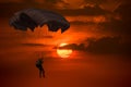 Silhouette man under control  parachute to the beach Royalty Free Stock Photo