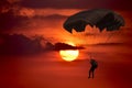 Silhouette man under control  parachute to the beach Royalty Free Stock Photo