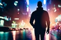 Silhouette of a man walking through the city at night Royalty Free Stock Photo
