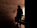 Silhouette of a man walking down the stairs Royalty Free Stock Photo