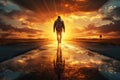 The silhouette of a man walking off into the sunset on a wet road Royalty Free Stock Photo