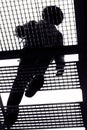 Silhouette man walking stairs. Black and white image. Bottom view