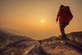 Silhouette man walking into sunset sky Royalty Free Stock Photo