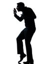 Silhouette man walking tiptoe quietly full length
