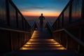 Silhouette of a man walking up the stairs against the backdrop of the night city Royalty Free Stock Photo