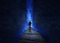 Silhouette of man walking through a passageway through the universe Royalty Free Stock Photo