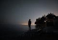 Silhouette of a man watching the starry night sky, a tranquil and magical scene