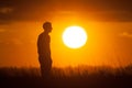 Silhouette of a Man Watching the Sunset Royalty Free Stock Photo