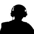 Silhouette of a man wearing spy headphones Royalty Free Stock Photo