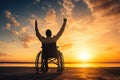 Silhouette of a man in a wheelchair on the beach at sunset, Disabled handicapped man has a hope. He is sitting on wheelchair and Royalty Free Stock Photo