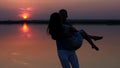 Silhouette man and woman dancing at sunset. Slow