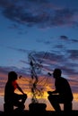 Silhouette man and woman eating each others marshmallows Royalty Free Stock Photo