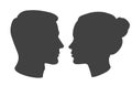 Silhouette of man and woman heads face to face in profile. Portrait of young beautiful girl, boy looking side. Vector Royalty Free Stock Photo