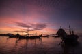 Silhouette of many boat and man on sea of Thailand in sunrise