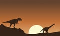 Silhouette of mapusaurus and argentinosaurus scenery