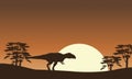 Silhouette of mapusaurus with tree scenery