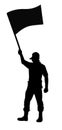 Silhouette of a Masked Male Protester Waving a Riot Slogan Flag in the Air