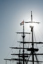 Silhouette of masts and rigging on an old sailboat under a blue sky Royalty Free Stock Photo