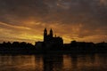 Silhouette of a medieval castle at beautiful bloody sunset at historical downtown of Magdeburg, old town, Elbe river and