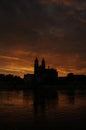 Silhouette of a medieval castle at beautiful bloody sunset at historical downtown of Magdeburg, old town, Elbe river and