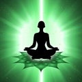 Silhouette of meditating person with heart chakra symbol background Royalty Free Stock Photo