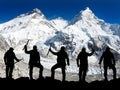 Silhouette of men with ice axe in hand, Mount Everest