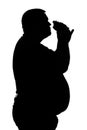 Silhouette of men with obesity who eats a hamburger