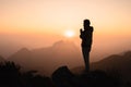 Silhouette of a men is praying to God on the mountain. Praying hands with faith in religion and belief in God on blessing Royalty Free Stock Photo