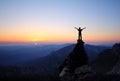 Silhouette of men on top of the mountain Royalty Free Stock Photo