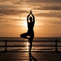 Silhouette men and woman practicing yoga in the sunset light Royalty Free Stock Photo