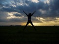 Silhouette. Men or women show joy in success at work. Royalty Free Stock Photo