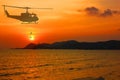 Silhouette military helicopter drop soldier on marine duty with sunset beauty sky abstract nature background