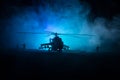 Silhouette of military helicopter ready to fly from conflict zone. Decorated night footage with helicopter starting in desert with Royalty Free Stock Photo