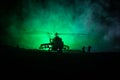 Silhouette of military helicopter ready to fly from conflict zone. Decorated night footage with helicopter starting in desert with Royalty Free Stock Photo