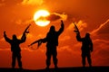 Silhouette of military soldier or officer with weapons at sunset.
