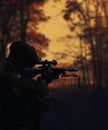 Silhouette of a military soldier with weapons at sunset