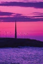 Silhouette of Millenium obelisk against a pink sky at dusk in Galicia Spain