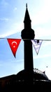 A silhouette of a minaret with a Turkish flag Royalty Free Stock Photo