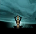 Silhouette of a monk meditating in a lotus position