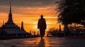 Silhouette of monk walking at Wat Phra Kaew at sunset, Bangkok, Thailand. Generative AI