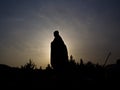 Silhouette of the monk `Xuanzang` statue in front of the big wild goose pagoda. It was built in 652 during the Tang dynasty and