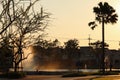 Silhouette monochrome natural twilight sky background with bright and beautiful spray of water at the open outdoor park on summer