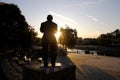 Silhouette of the Monument of Saban Bajramovic on Nisava river quay at sunset in Nis, Serbia