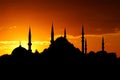 silhouette of mosque domes and minarets at sunset