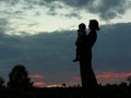 Silhouette mother with baby